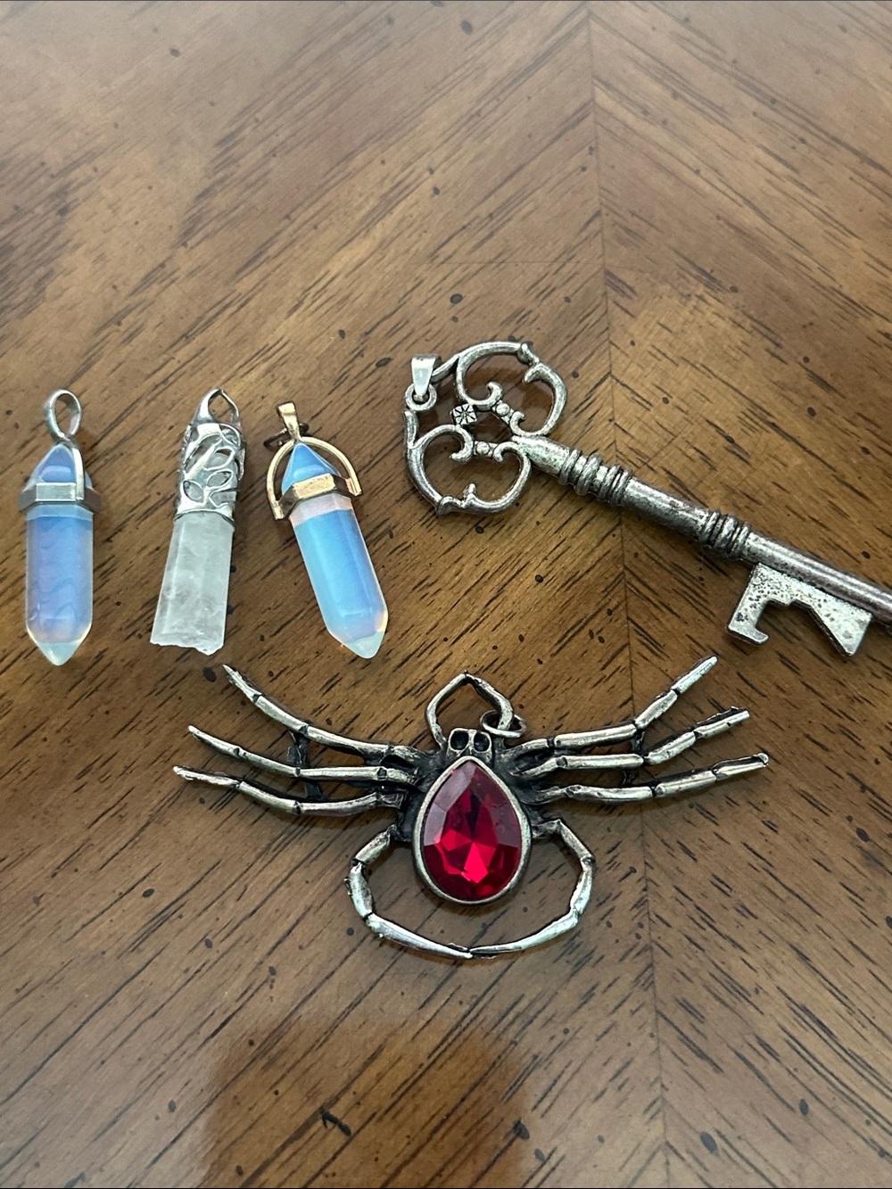 Lot of pendants. Spider Pendant with Red Gem and Crystal Point Pendants